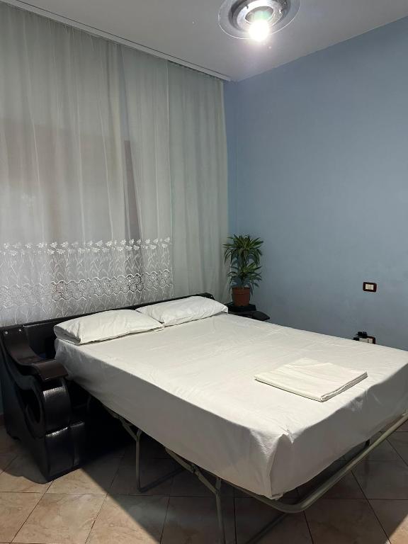 Postel nebo postele na pokoji v ubytování Vlora House