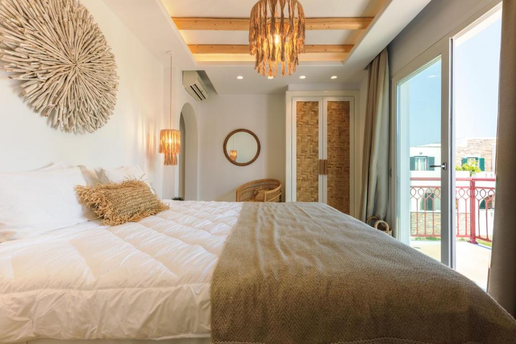 Postel nebo postele na pokoji v ubytování Aegean Palace
