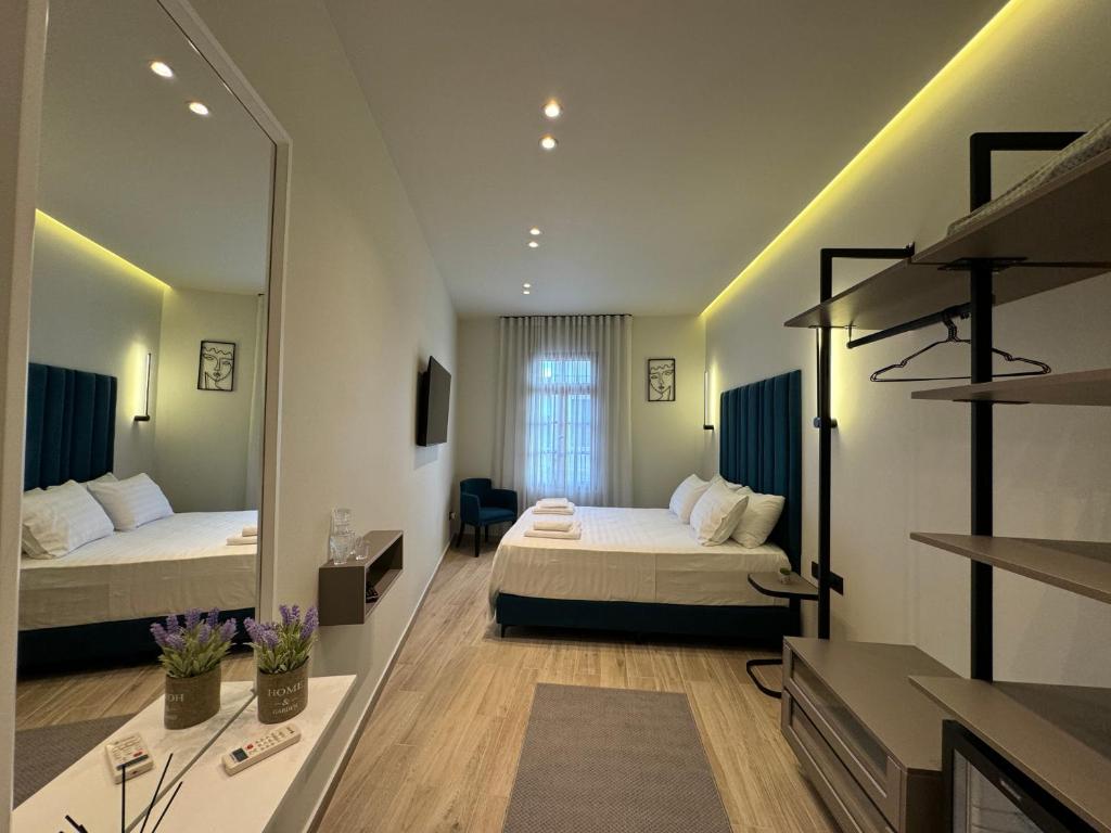 Postel nebo postele na pokoji v ubytování The cosy inn vlora