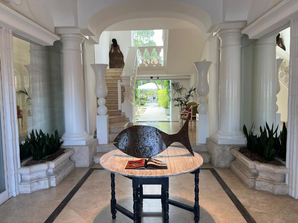 a room with a table with a duck on it at Relais Corte Degli Aragonesi in Ischia