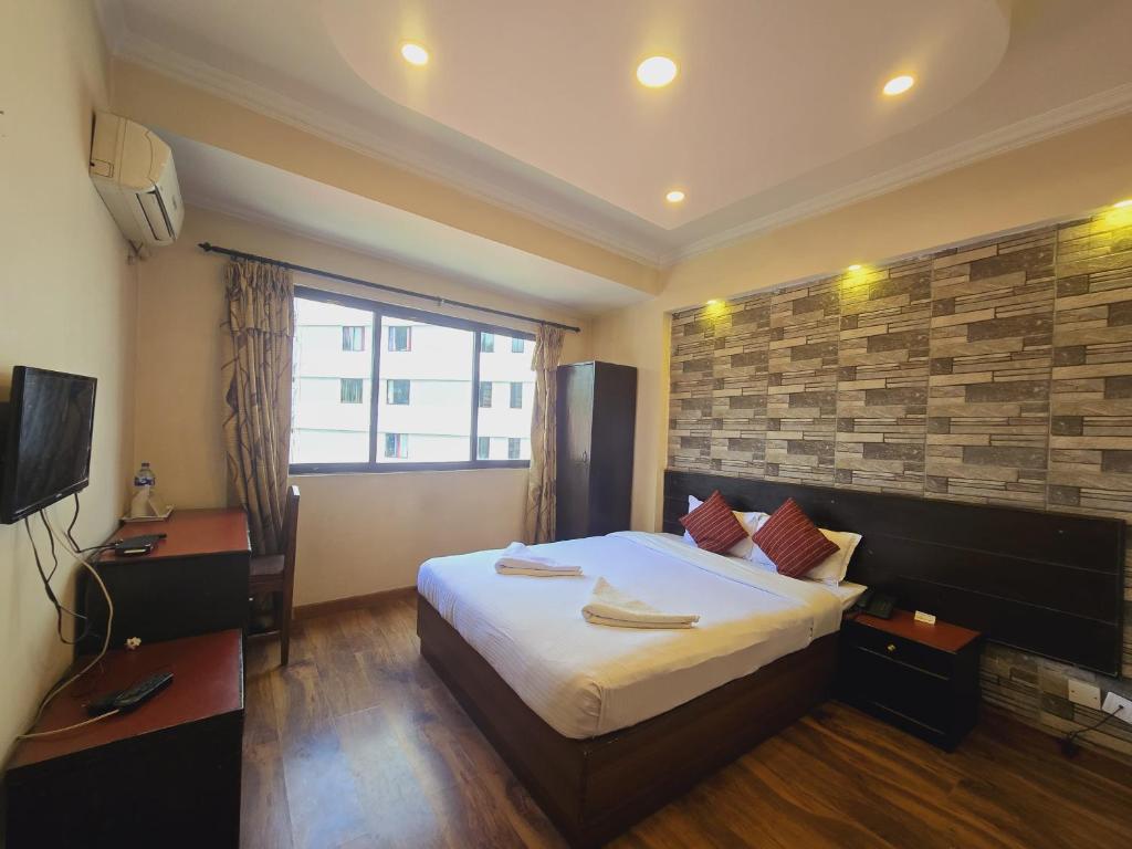 TV a/nebo společenská místnost v ubytování Cascade Hotel