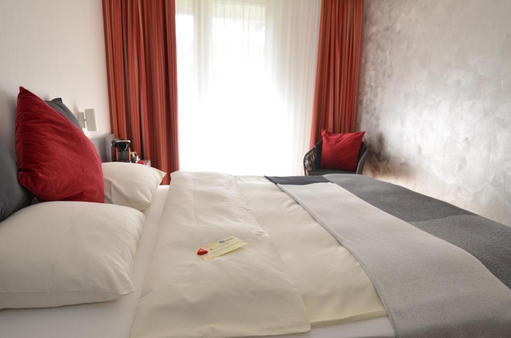 Postel nebo postele na pokoji v ubytování Hotel Egerkingen, idealer Zwischenstopp