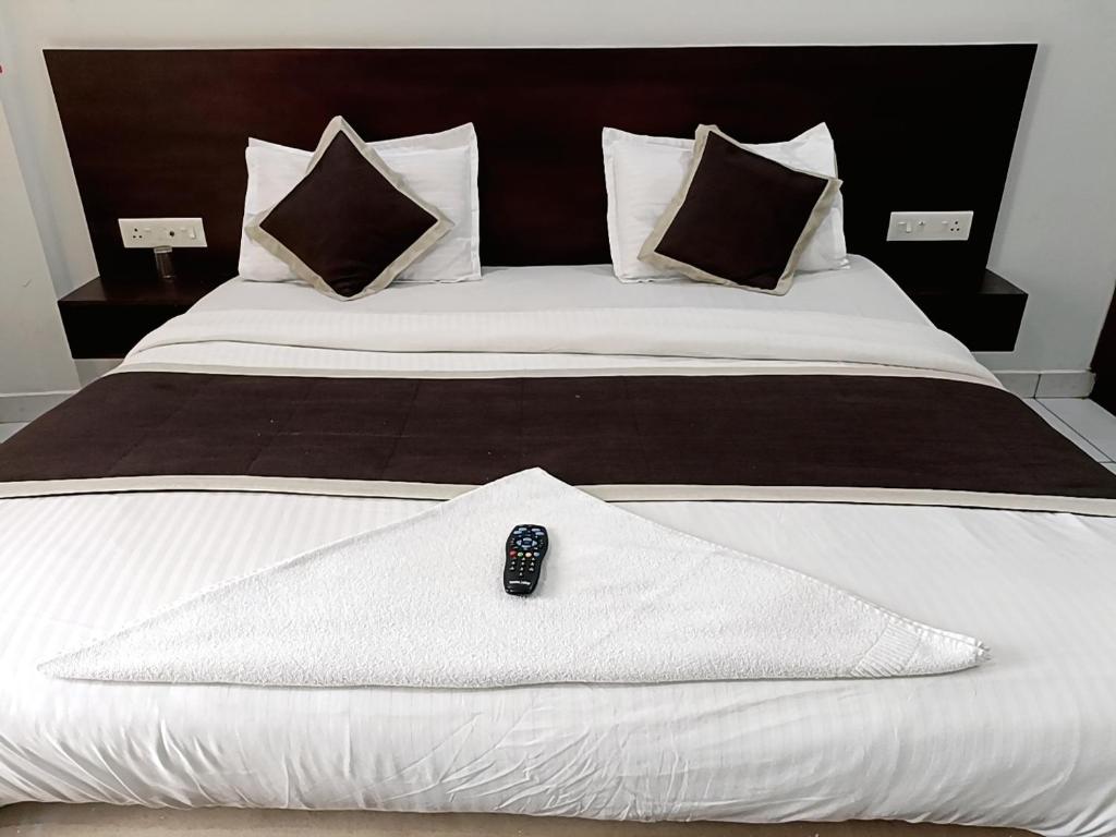 Postel nebo postele na pokoji v ubytování Grace Tourist Home