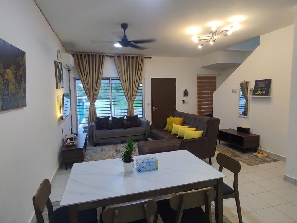 a living room with a table and a couch at Homestay Banting Selangor in Banting