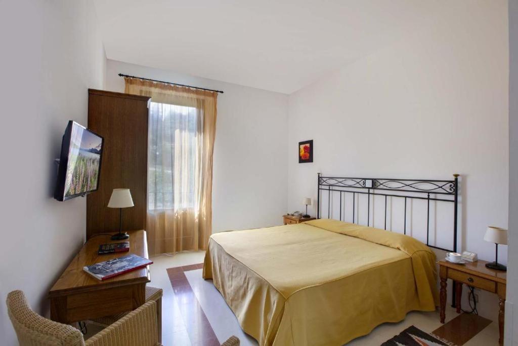 Postel nebo postele na pokoji v ubytování Hotel Baglio Santacroce