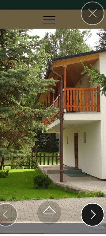 a picture of a house with a balcony at Penzion a restaurace Balaton in Šluknov