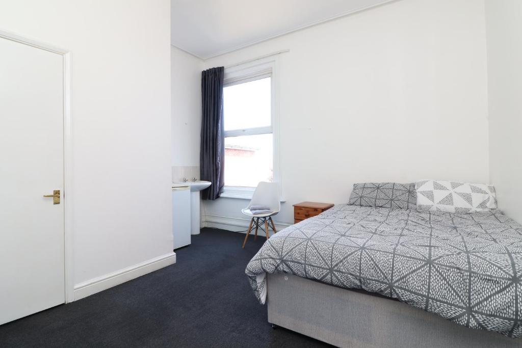 Ένα ή περισσότερα κρεβάτια σε δωμάτιο στο Pebbles guest house room 5