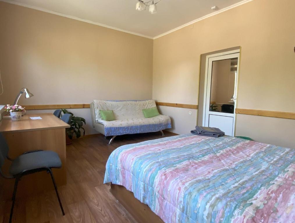 Postel nebo postele na pokoji v ubytování Tian-Shan Guest House