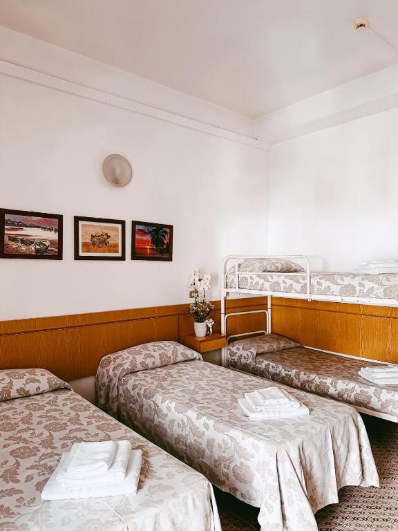 Postel nebo postele na pokoji v ubytování Hotel Paglierani - Nuova gestione 2024