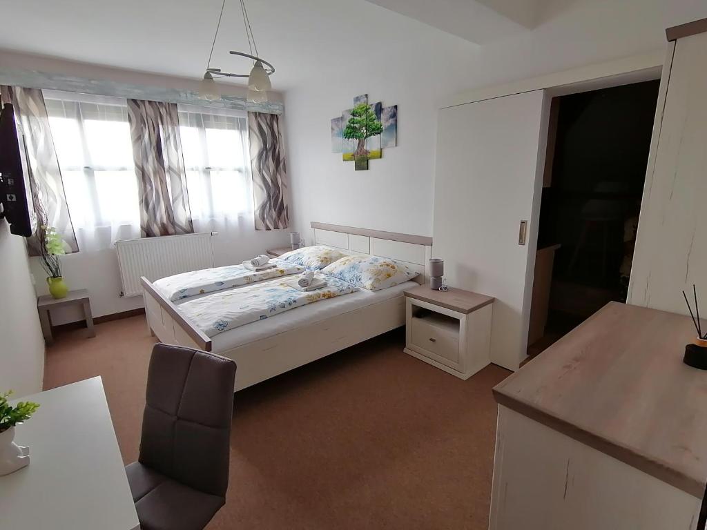 Postel nebo postele na pokoji v ubytování Apartmán Nelli