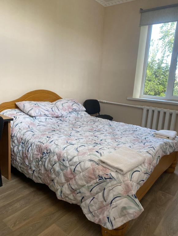 Postel nebo postele na pokoji v ubytování Tian-Shan Guest House
