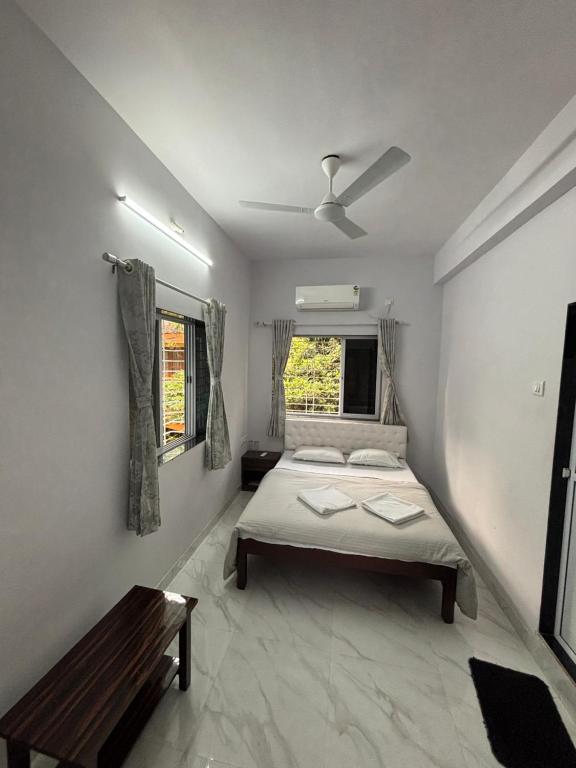 Postel nebo postele na pokoji v ubytování White Haven Homestay