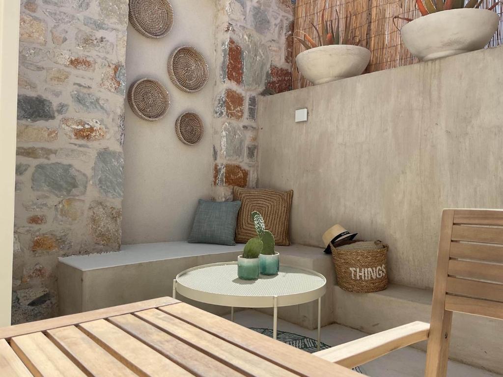 a small room with a couch and a table at Synoikies by Oikieskiathos in Skiathos