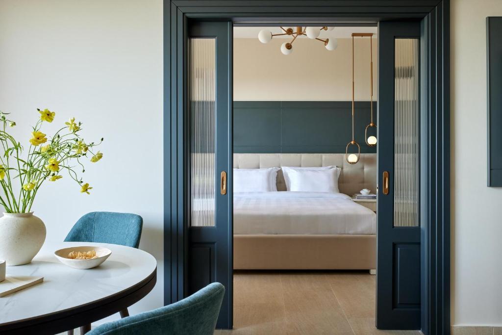 A bed or beds in a room at Pomegranate Wellness Spa Hotel