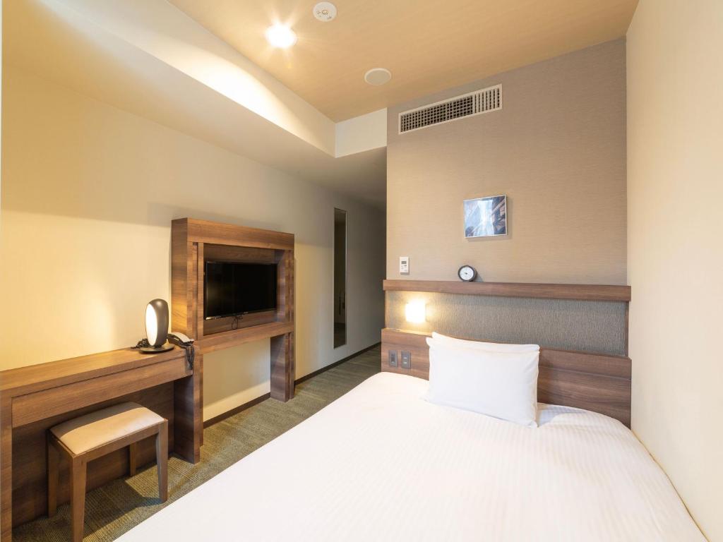 TV a/nebo společenská místnost v ubytování Hotel Keihan Yodoyabashi