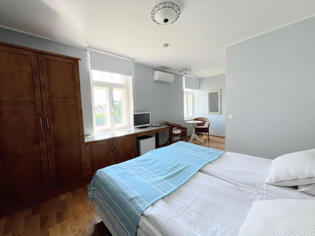 Postel nebo postele na pokoji v ubytování Tulbi Guesthouse