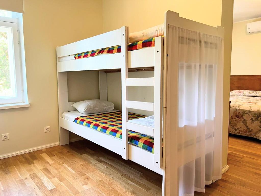 Postel nebo postele na pokoji v ubytování Tulbi Guesthouse