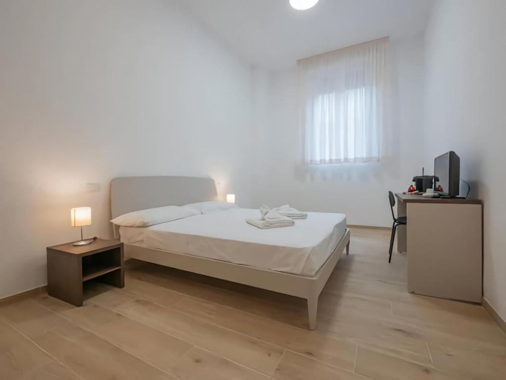 Postel nebo postele na pokoji v ubytování Casa Sforza Fondazione Prada Suite