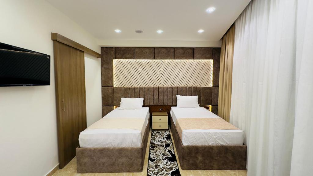 Voodi või voodid majutusasutuse Locanda pyramids view toas