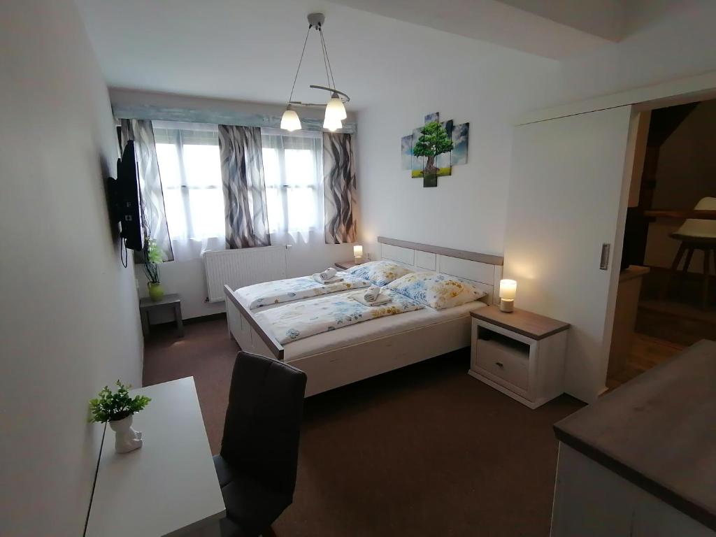 Postel nebo postele na pokoji v ubytování Apartmán Nelli