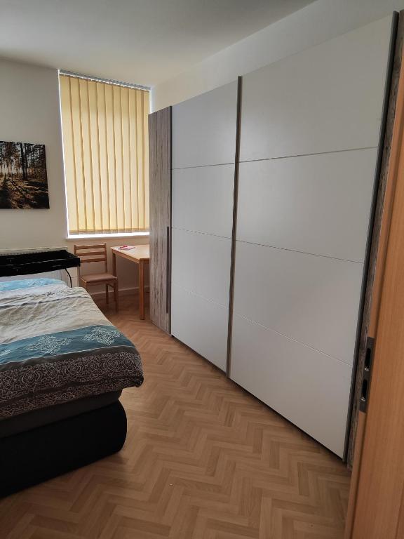 Ein Bett oder Betten in einem Zimmer der Unterkunft Ferienwohnungen An der Fichtelbergbahn