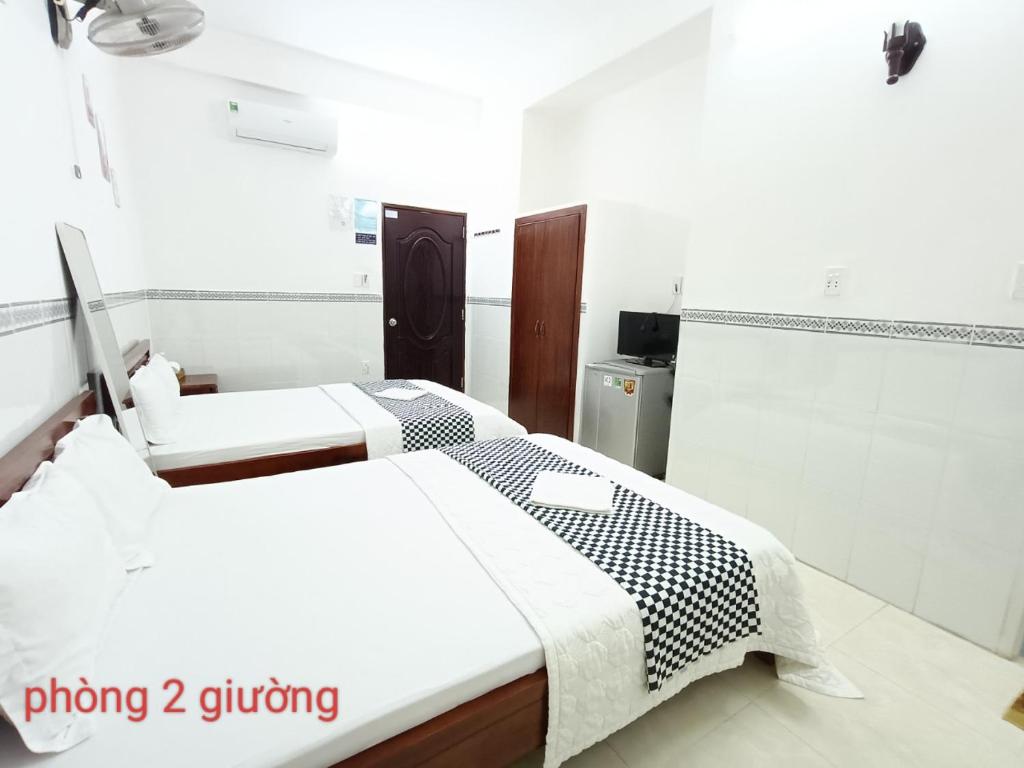 Postel nebo postele na pokoji v ubytování Anh Tan Hotel