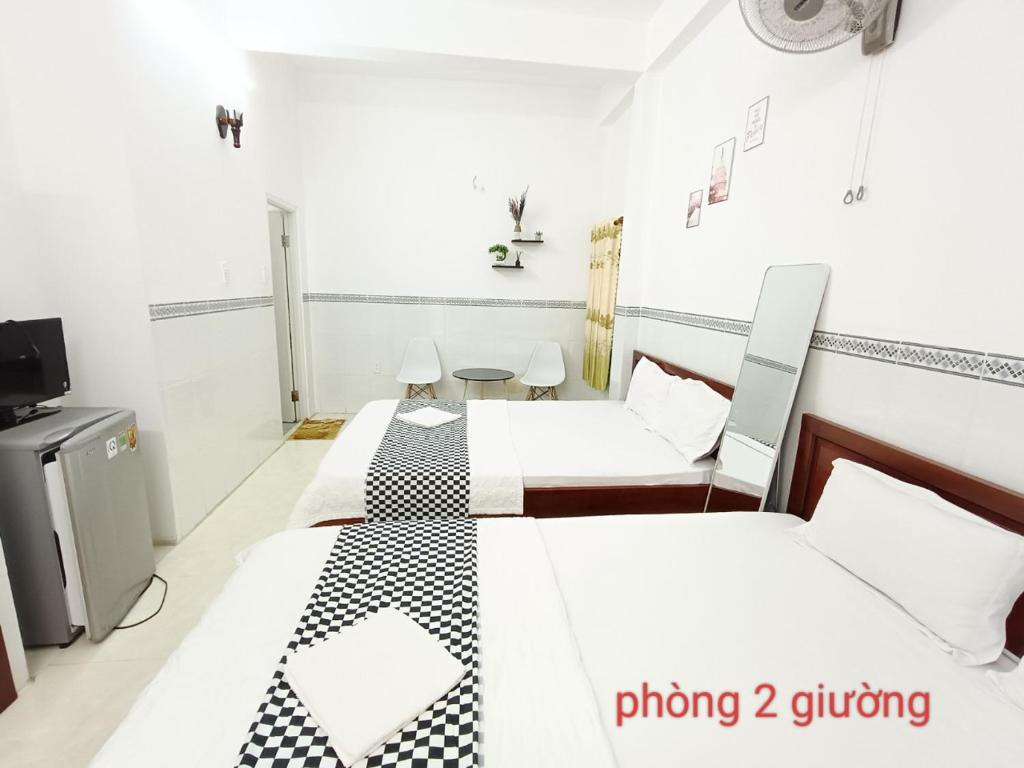 Postel nebo postele na pokoji v ubytování Anh Tan Hotel
