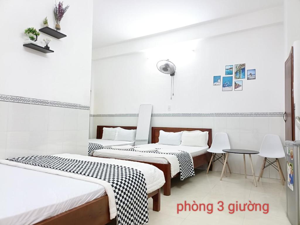 Postel nebo postele na pokoji v ubytování Anh Tan Hotel