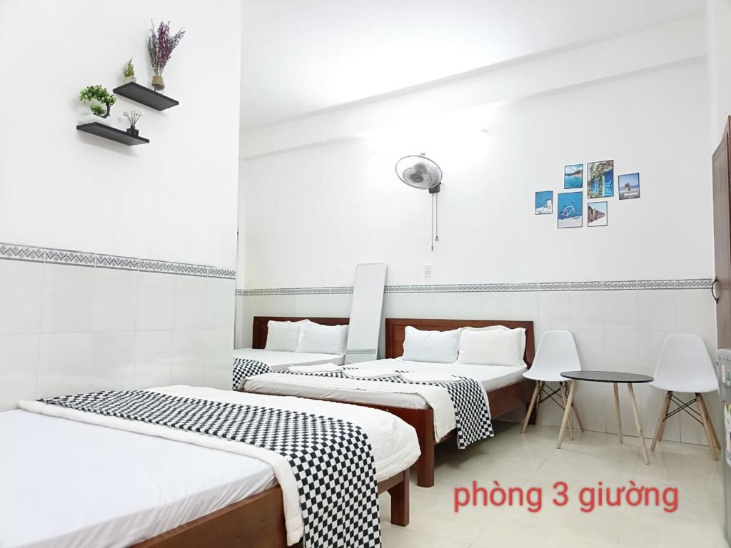 Postel nebo postele na pokoji v ubytování Anh Tan Hotel