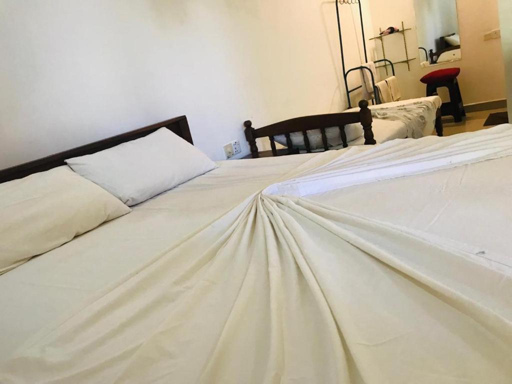 Postel nebo postele na pokoji v ubytování Gimansa Rest Sigiriya