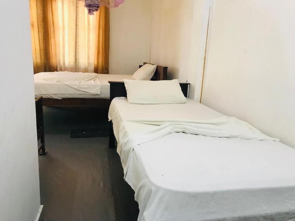 Postel nebo postele na pokoji v ubytování Gimansa Rest Sigiriya