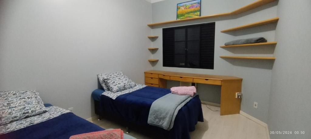 Postel nebo postele na pokoji v ubytování Casa 4 quartos com piscina