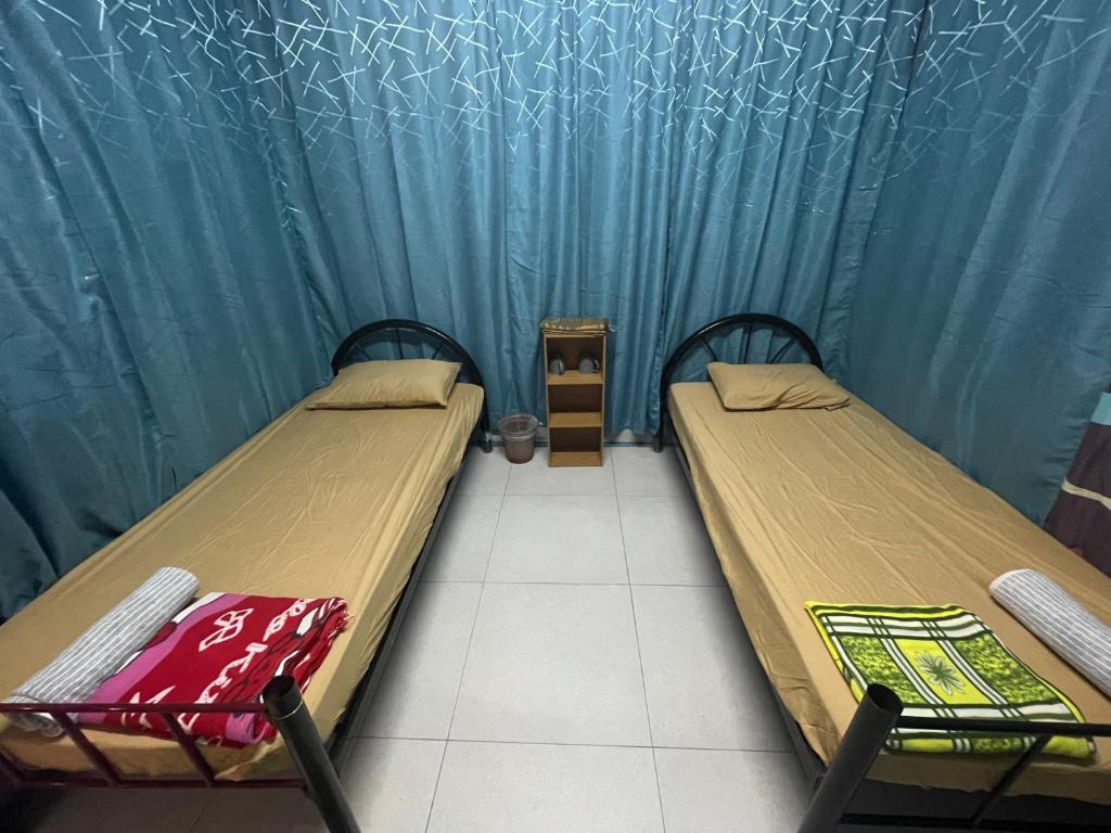 Postel nebo postele na pokoji v ubytování Memory Lane Tioman