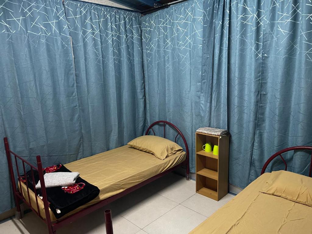 Postel nebo postele na pokoji v ubytování Memory Lane Tioman