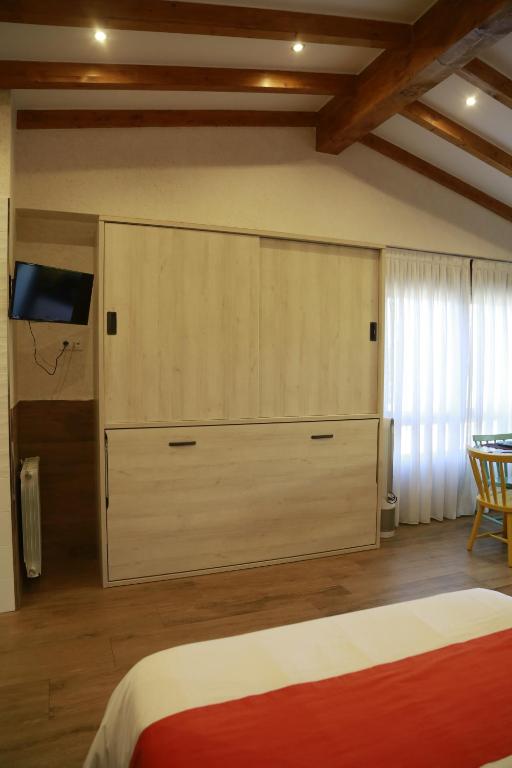 A bed or beds in a room at Apartamentos La Arena