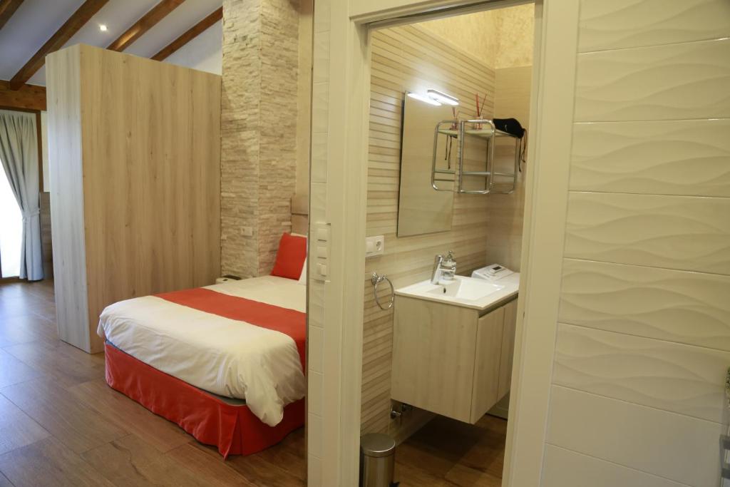 A bed or beds in a room at Apartamentos La Arena