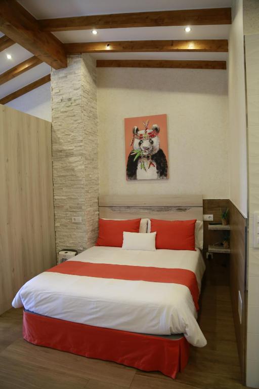 A bed or beds in a room at Apartamentos La Arena