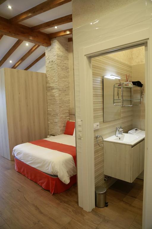 A bed or beds in a room at Apartamentos La Arena