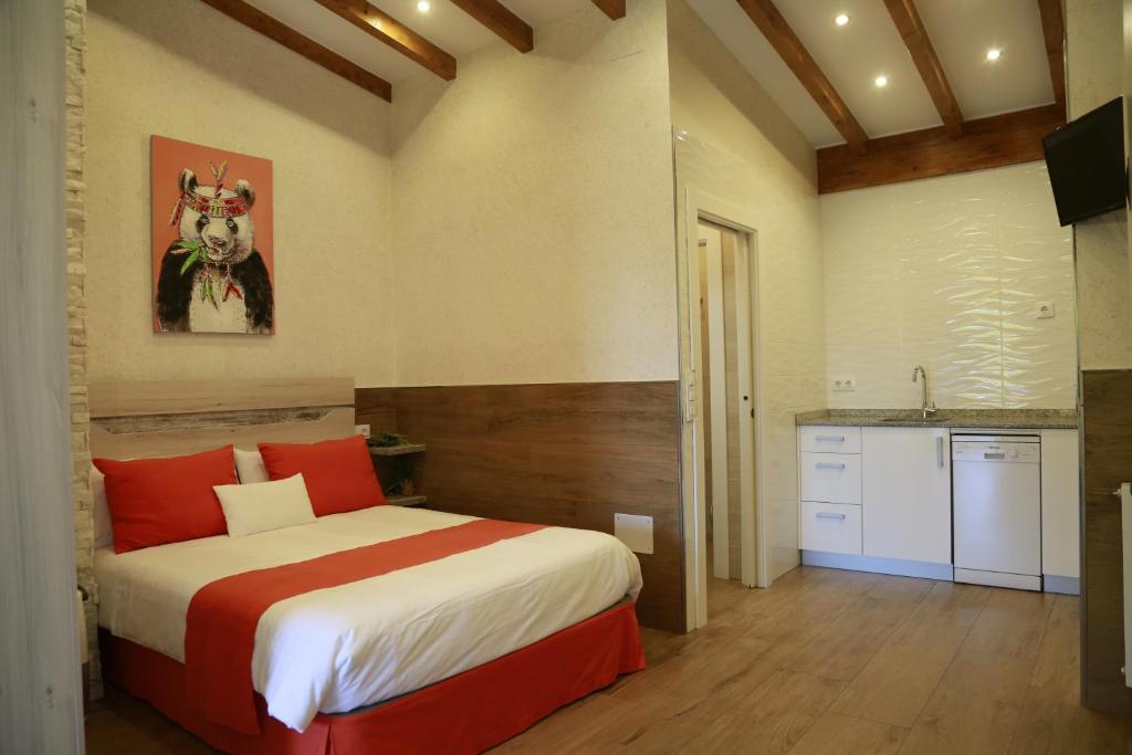 A bed or beds in a room at Apartamentos La Arena