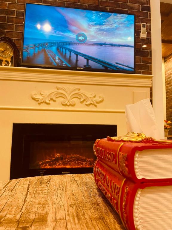 TV a/nebo společenská místnost v ubytování بيتي بلس للغرف الفندقية- مدخل مستقل