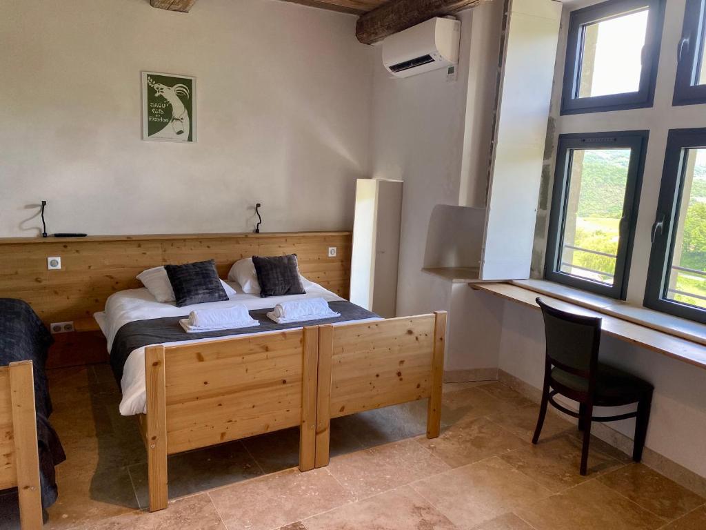 Postel nebo postele na pokoji v ubytování Château du Poët-Célard