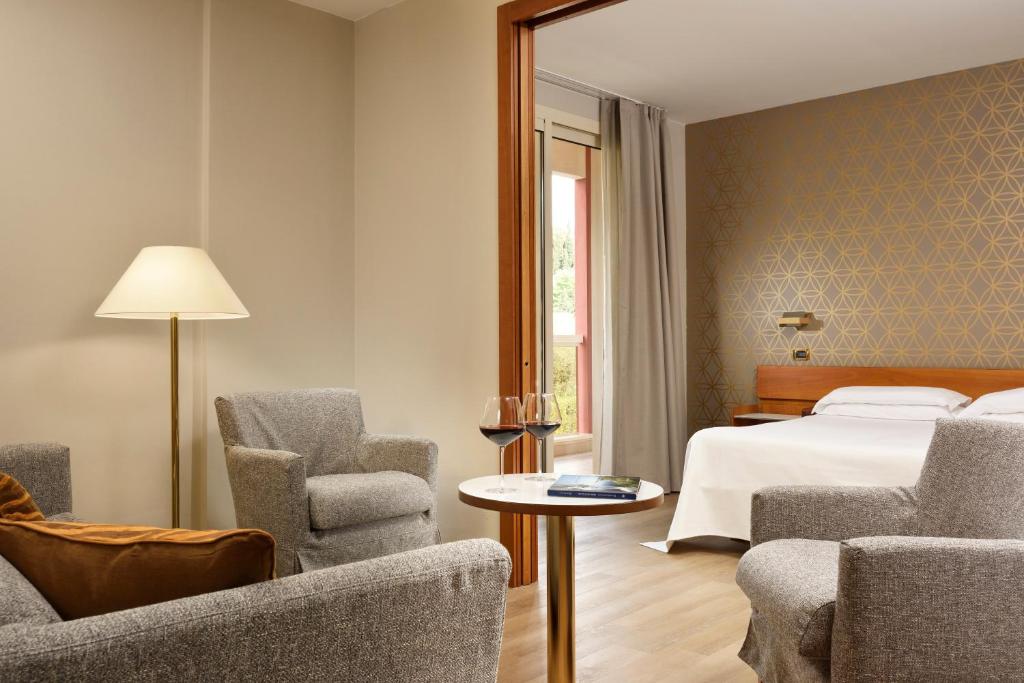 Postel nebo postele na pokoji v ubytování Hotel Continental Wellness & Spa
