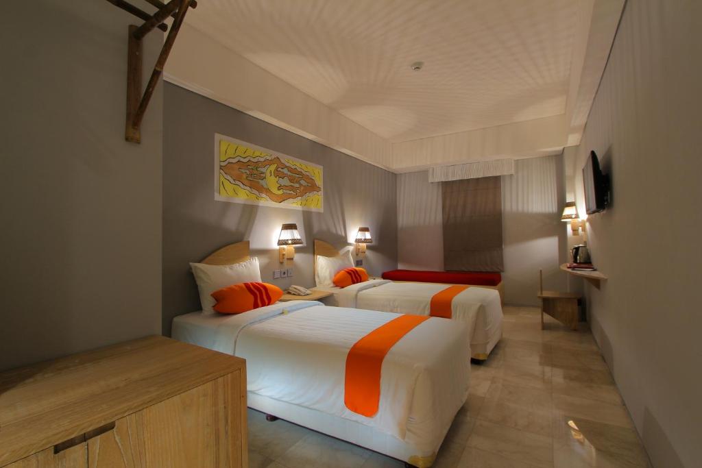 Postel nebo postele na pokoji v ubytování Koa D Surfer Hotel