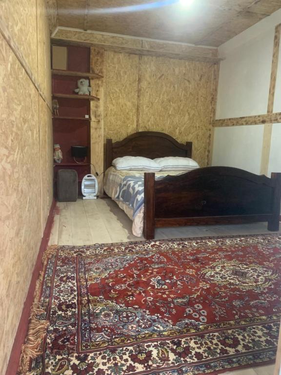 Postel nebo postele na pokoji v ubytování Guesthouse Aprasidze