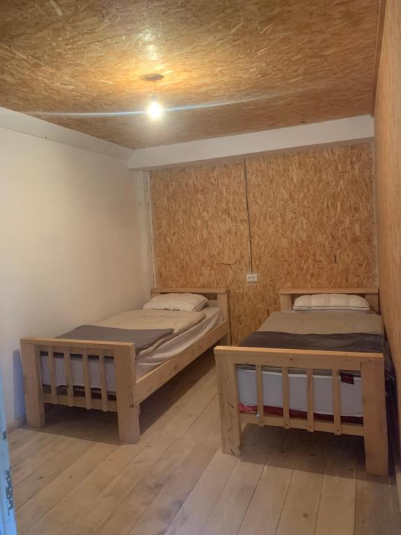 Postel nebo postele na pokoji v ubytování Guesthouse Aprasidze