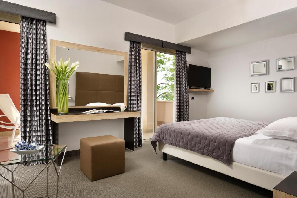 Postel nebo postele na pokoji v ubytování Hotel Continental Wellness & Spa