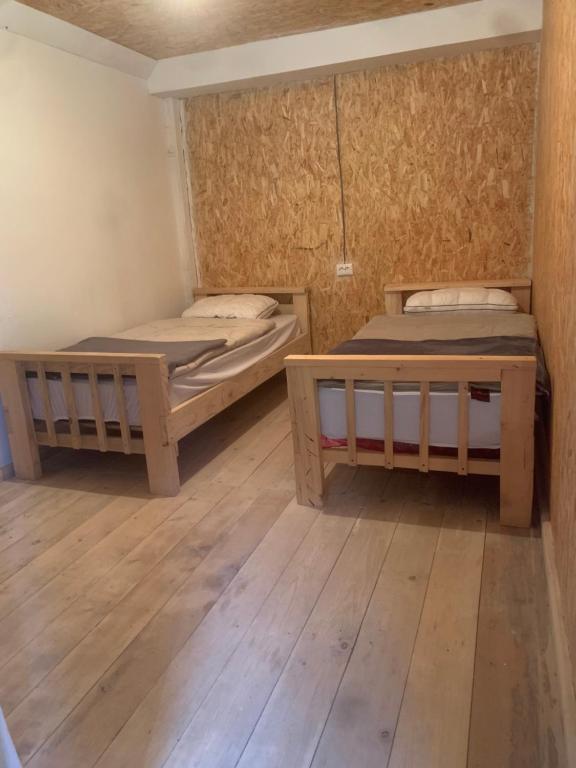 Postel nebo postele na pokoji v ubytování Guesthouse Aprasidze