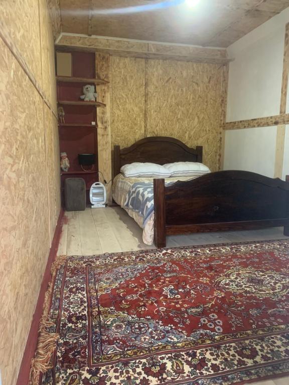 Postel nebo postele na pokoji v ubytování Guesthouse Aprasidze