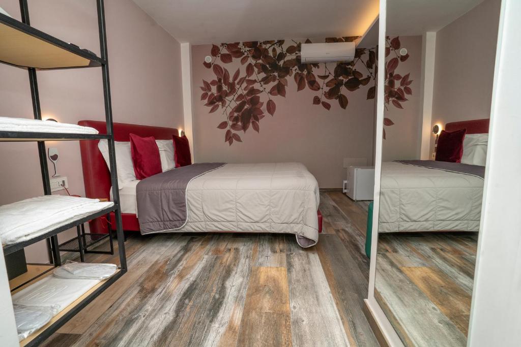 Postel nebo postele na pokoji v ubytování Vesuvio Inn Bed & Wine Experience