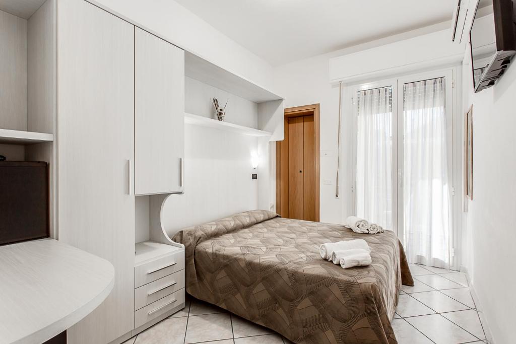 Postel nebo postele na pokoji v ubytování Hotel Anthos